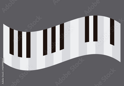 Teclado de un piano en fondo gris.