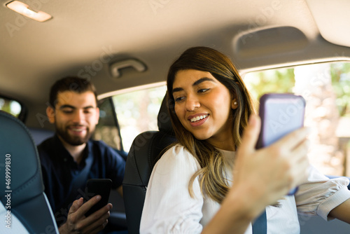 Attractive driver working on a rideshare app photo