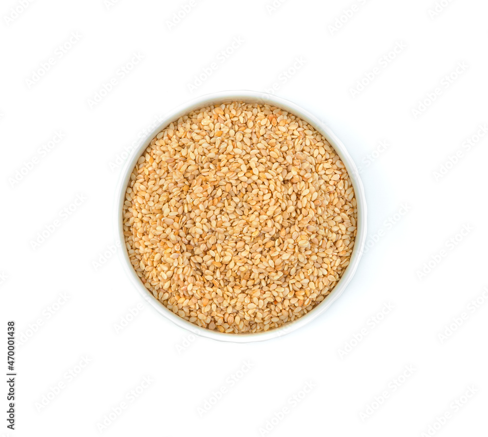 Sesame seeds in a ceramic bowl, isolated on white. Sesame seeds in a ceramic bowl, isolated on white.