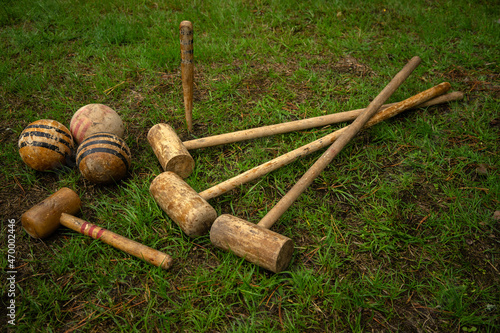 Vintage croquet set. Wooden clubs with croquet balls. An old-fashioned outdoor game.