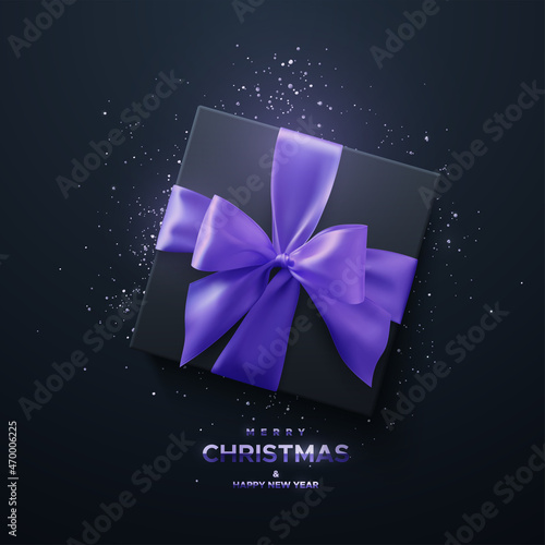 Merry Christmas and Happy New Year metallic sign. Black gift box with purple bow and crossing ribbons on black background.