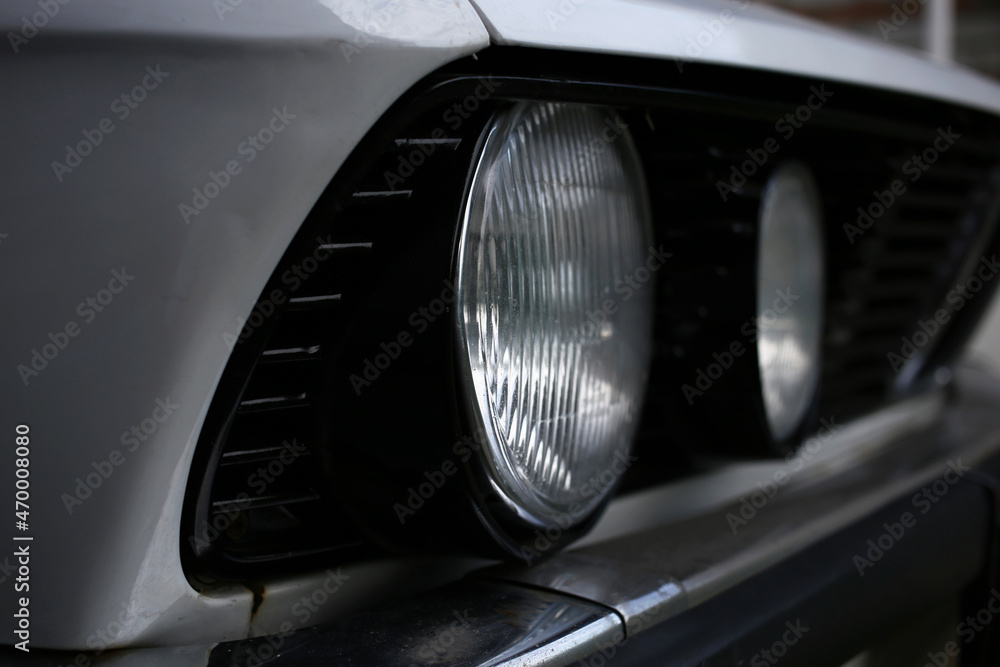 Round headlights of an old retro german car, style of 80th. Round headlights of an old retro german car, style of 80th.