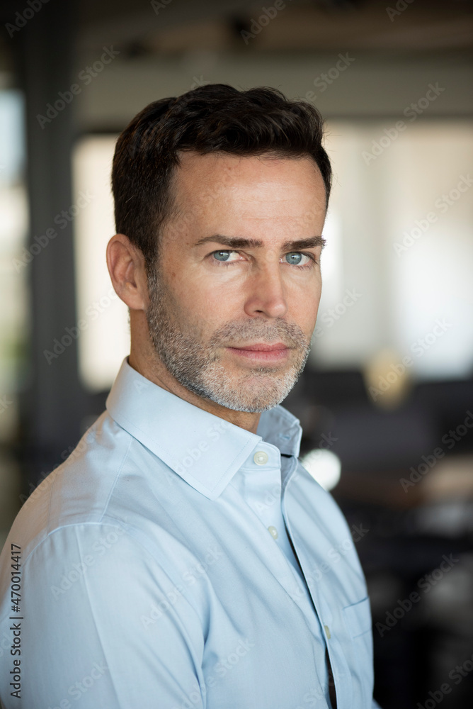 Portrait of thoughtful businessman in office Portrait of thoughtful businessman in office