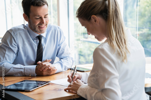 Businessman and businesswoman working in office