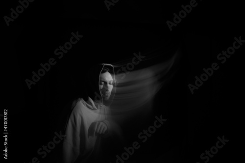 Portrait blurred in the dark.Portrait in motion.