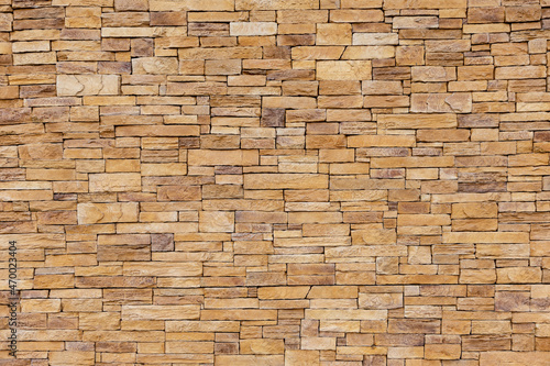 Stone tile of mosaic exterior cover on modern building  material Seamless textured wall background