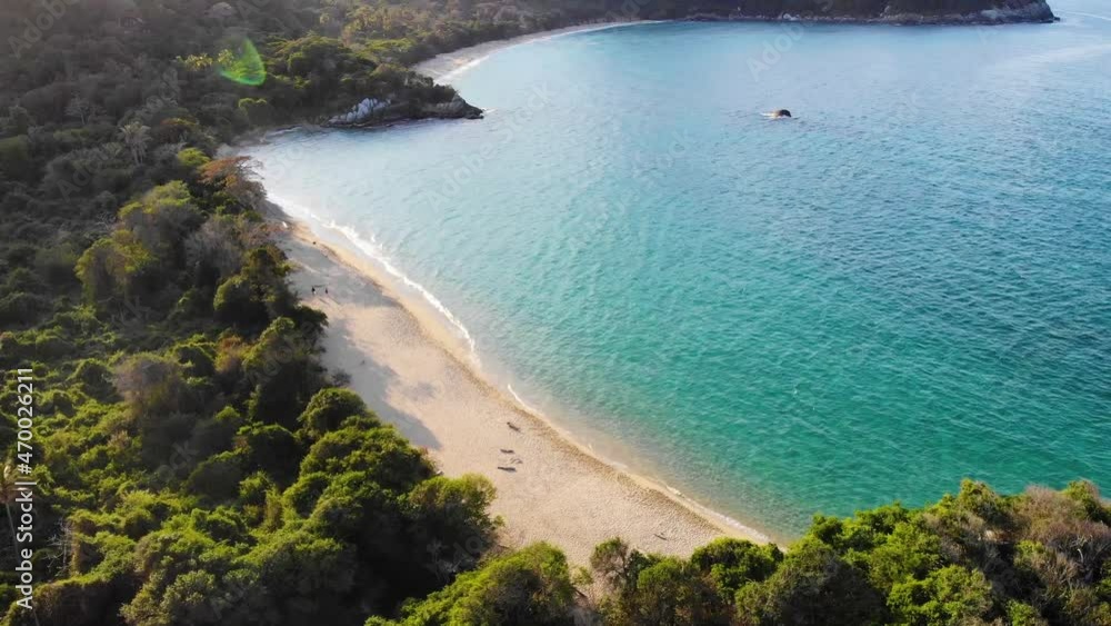 Aerial view towards a paradise beach, in Tayrona, Colombia - tilt, drone shot Aerial view towards a paradise beach, in Tayrona, Colombia - tilt, drone shot