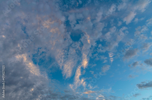 Puffy altocumulus clouds in a blue sunrise sky photo