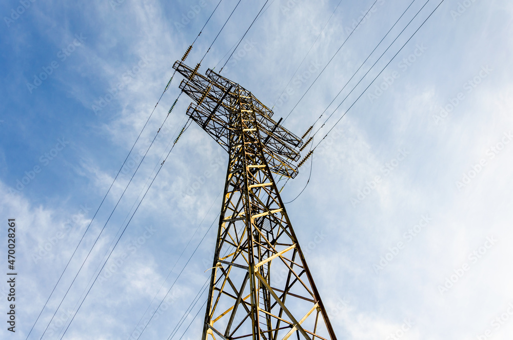 Power line support in the field on a summer day. Power line support in the field on a summer day.