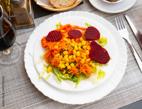 Fresh vegetable salad with corn, carrots and beets