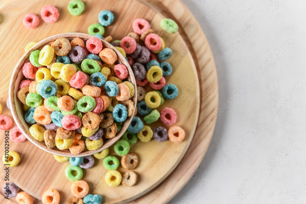 Bowl with crunchy corn flakes rings on white background Bowl with crunchy corn flakes rings on white background