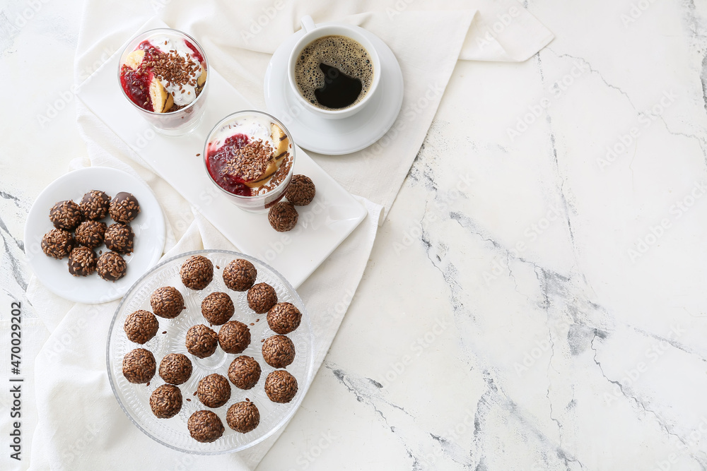 Tasty desserts with flax seeds and cup of coffee on white background Tasty desserts with flax seeds and cup of coffee on white background