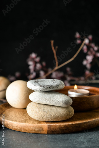 Stacked zen stones and cand...