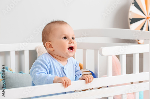 Cute little baby boy in crib