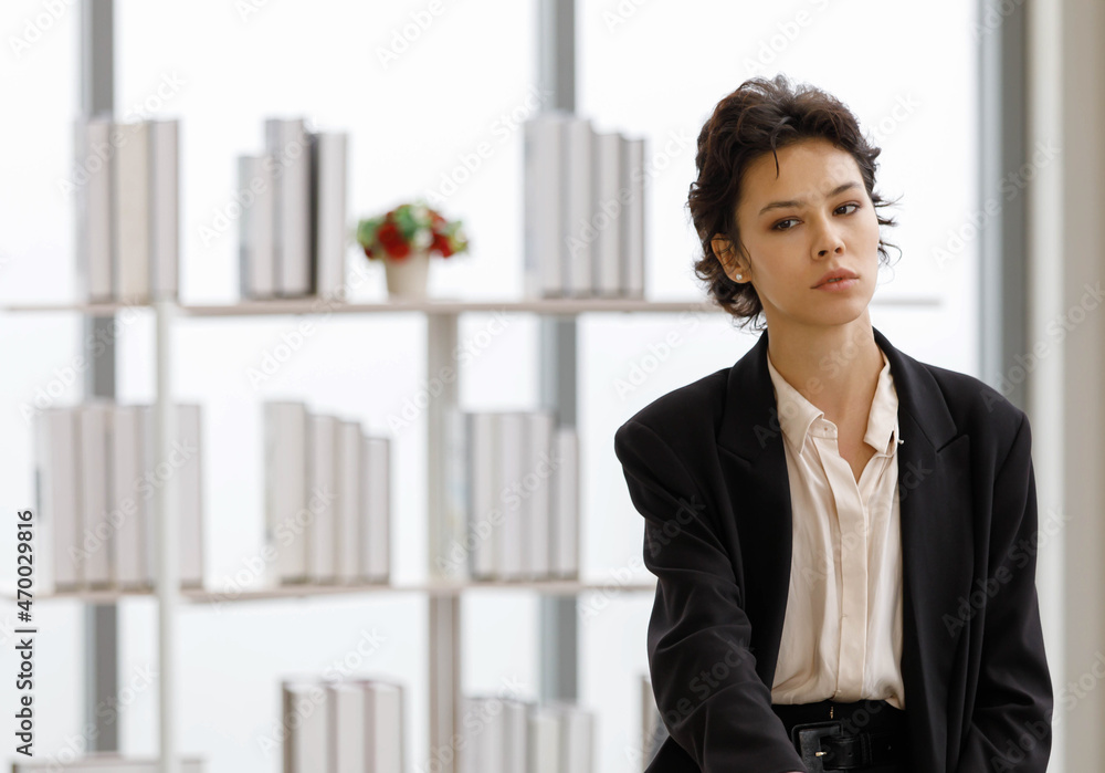 Self confident businesswoman in modern office Self confident businesswoman in modern office
