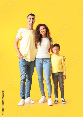 Happy interracial family on color background © Pixel-Shot
