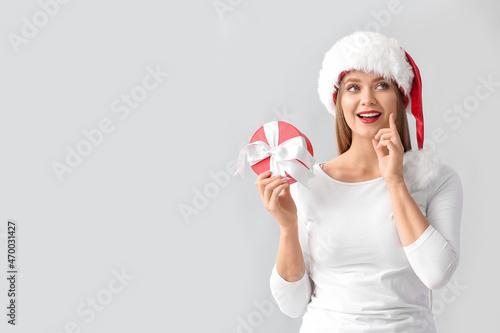 Thoughtful young woman in S...