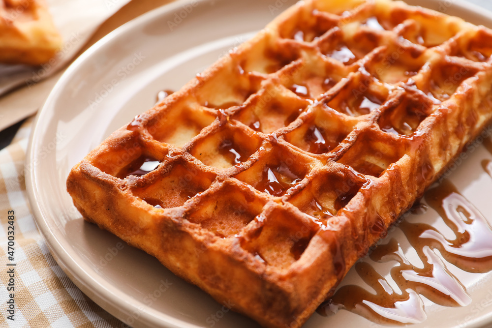 Plate with yummy Belgian waffle and jam on table, closeup Plate with yummy Belgian waffle and jam on table, closeup