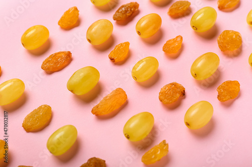 Wallpaper Mural Fresh grapes and sweet raisins on color background Torontodigital.ca