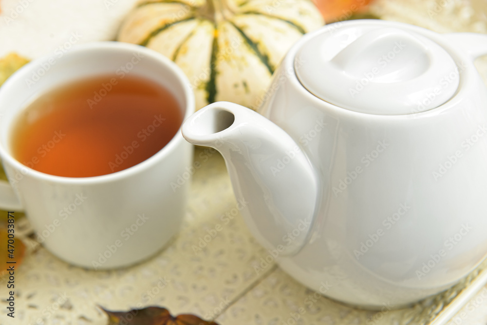 Tray with tea pot on table, closeup Tray with tea pot on table, closeup