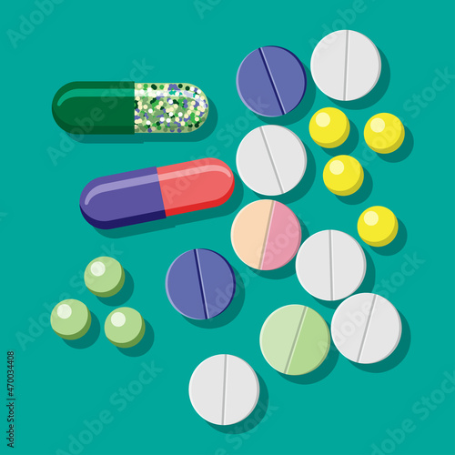 tablets, vitamins, capsules on a turquoise background