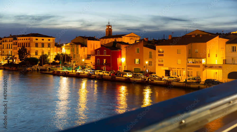 Picturesque streets with backlit village of Martigues at night. France