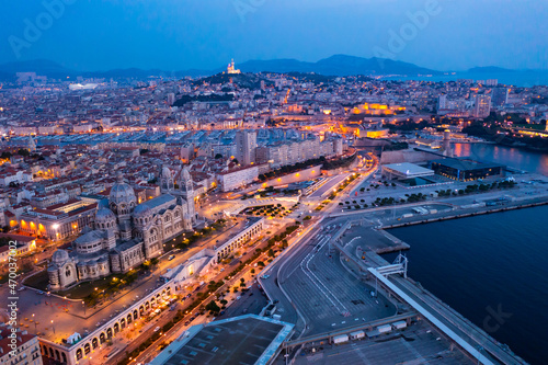 Bird's eye view of Marseille at dusk. Marseille Cathedral visible from above.