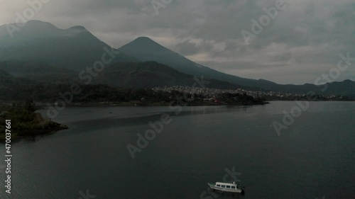 Boat Sailing In Lake nearby Santiago Atitlan Sololá Guatemala - aerial shot photo