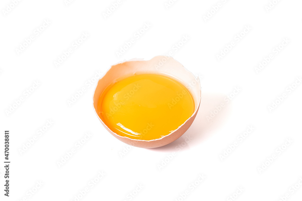 half broken egg and yolk isolated on white background with clipping path. - obrazy, fototapety, plakaty 