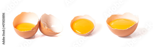 half broken egg and yolk isolated on white background with clipping path. photo