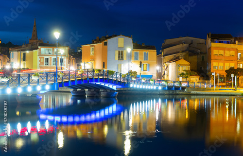 Scenic view of Provencale Venice, French town of Martigues on Mediterranean coast overlooking buildings on bank of canal at dusk in early autumn