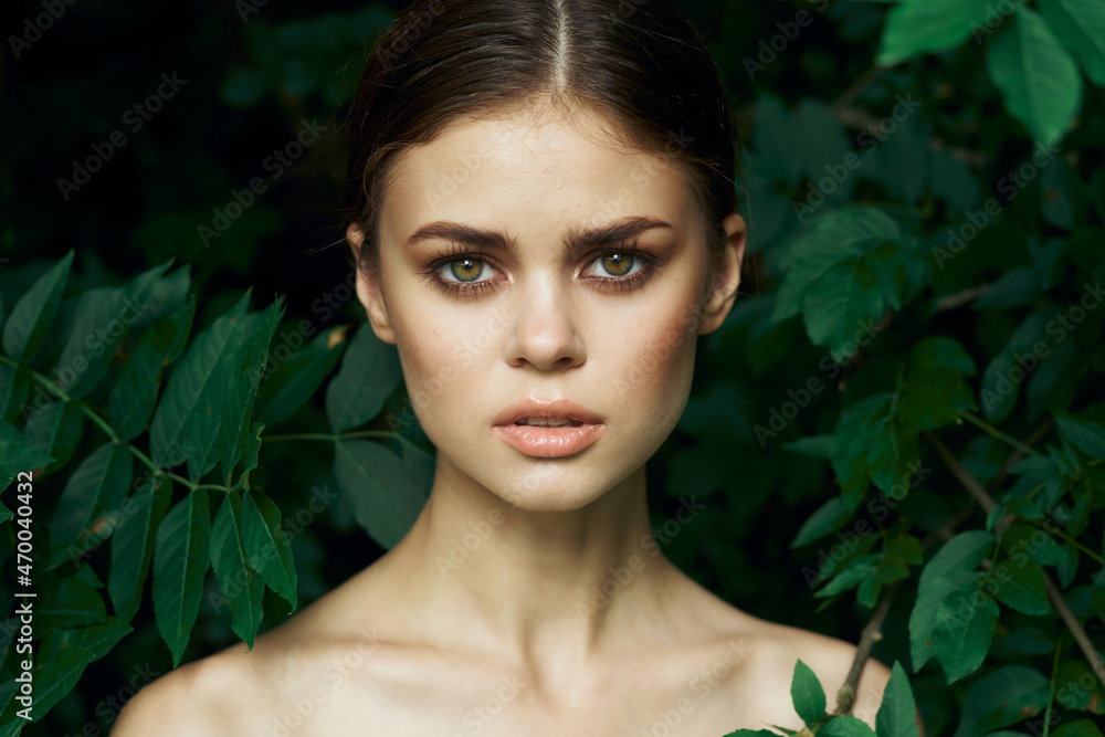 attractive woman green leaves clean skin nature summer close-up attractive woman green leaves clean skin nature summer close-up
