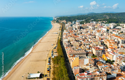 Aerial photo of Spanish town Calella with view of beach and residential buildings. photo