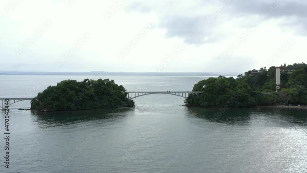 Long pedestrian bridge and Bahia Principe Grand Cayacoa resort, Samana bay in Dominican republic. Aerial view Long pedestrian bridge and Bahia Principe Grand Cayacoa resort, Samana bay in Dominican republic. Aerial view