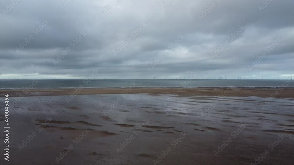 horizon line looking fine in the distance. reflective light shining on the sand and it all looking grand horizon line looking fine in the distance. reflective light shining on the sand and it all looking grand