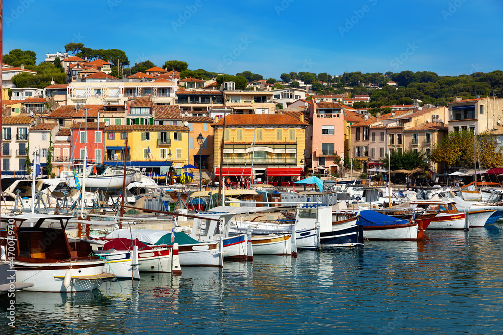 Landscape with yachts and fishing boats in harbour of Cassis on sunny summer day, Provence, France