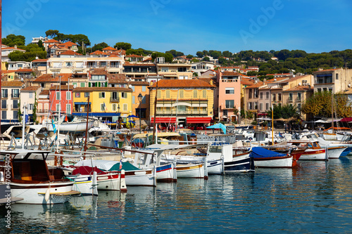 Landscape with yachts and fishing boats in harbour of Cassis on sunny summer day  Provence  France