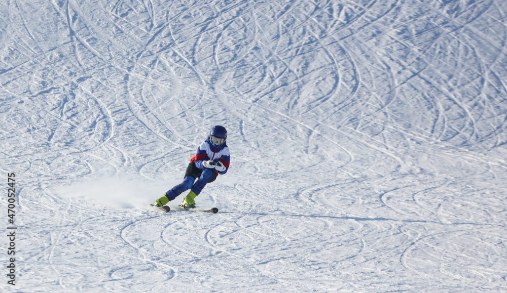 A man is skiing in the snow A man is skiing in the snow