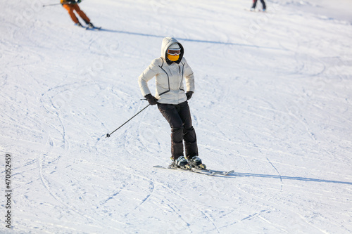 A man is skiing in the snow