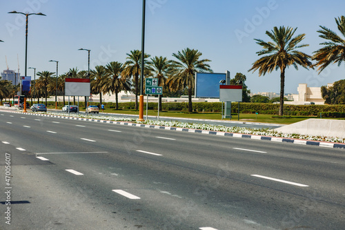 Asphalt road with modern city skyline of Dubai. © fotofabrika