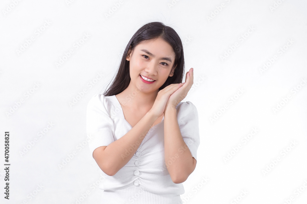 Young Asian beautiful woman who has long hair smiles and shows her hand near face on white background. Young Asian beautiful woman who has long hair smiles and shows her hand near face on white background.