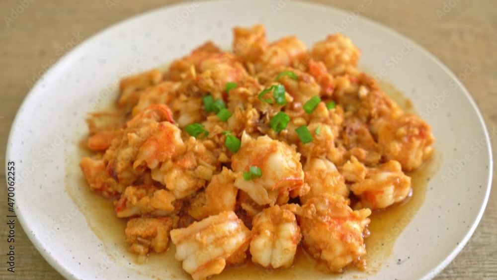stir-fried shrimps with garlic and shrimps paste on whie plate stir-fried shrimps with garlic and shrimps paste on whie plate