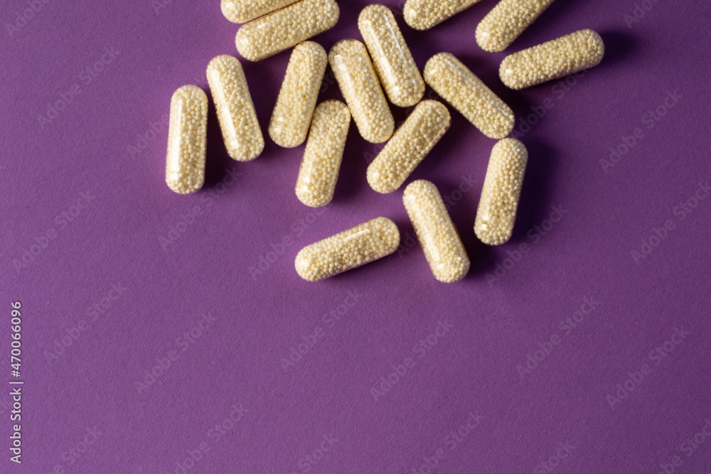 custom made wallpaper toronto digitalMagnesium capsules. Magnesium in transparent capsules with granules inside. Pills on a purple background.
