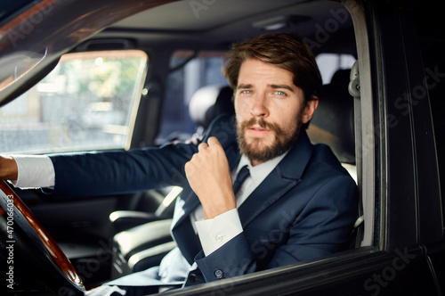 businessmen in a suit in a car a trip to work communication by phone © SHOTPRIME STUDIO