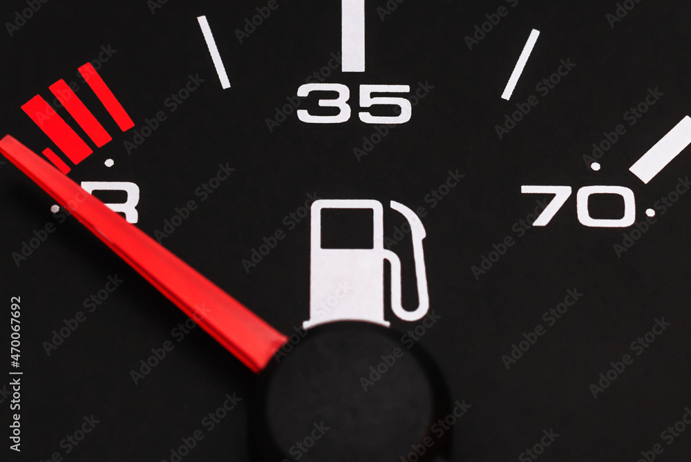 Fuel gauge with red indicator at empty level.Close-up car dash board petrol meter, fuel gauge, with over full gasoline in car. Clip.Gasoline sensor Fuel gauge with red indicator at empty level.Close-up car dash board petrol meter, fuel gauge, with over full gasoline in car. Clip.Gasoline sensor