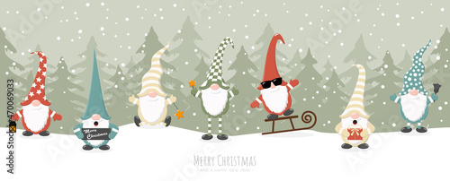christmas gnomes with winter firs background
