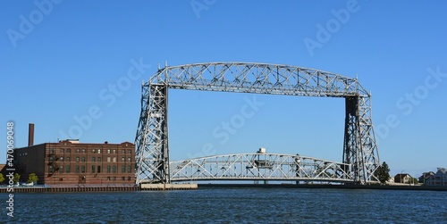 the aerial lift bridge from lake superior into duluth harbor across minnesota point on a sunny fall day in duluth, minnesota 