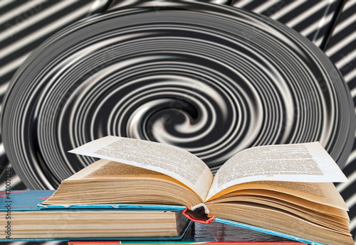 Unfolded book from above on books on a spiral background