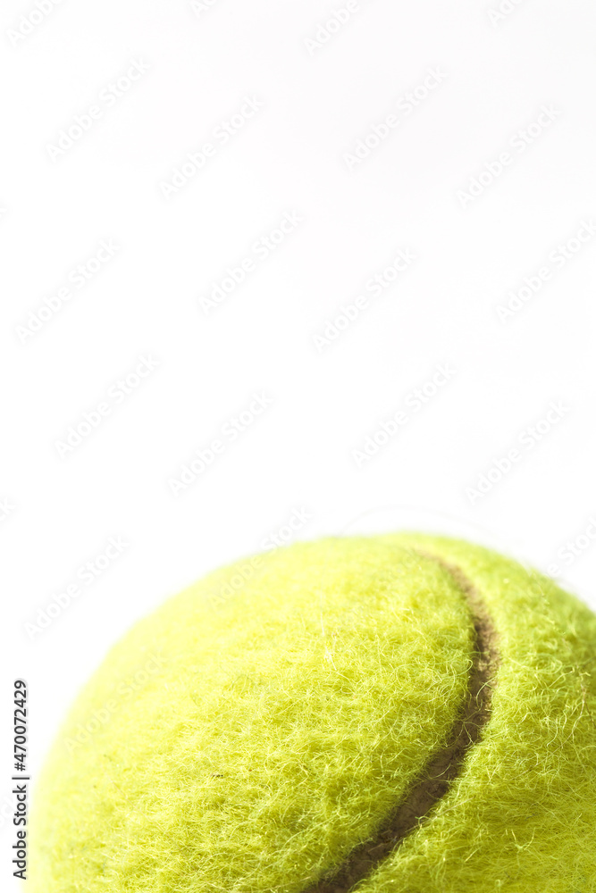 Part of a tennis ball on a white background - place for an inscription