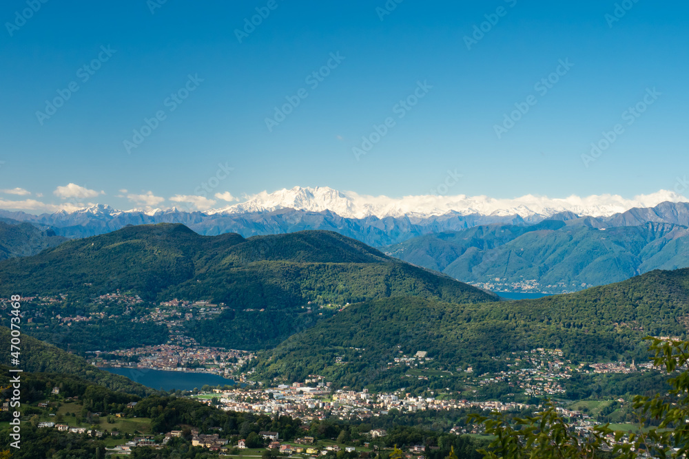 Lugano, Switzerland - October 6th 2021: View from Monte San Salvatore towards the impressive Monte Rosa massive. Lugano, Switzerland - October 6th 2021: View from Monte San Salvatore towards the impressive Monte Rosa massive.